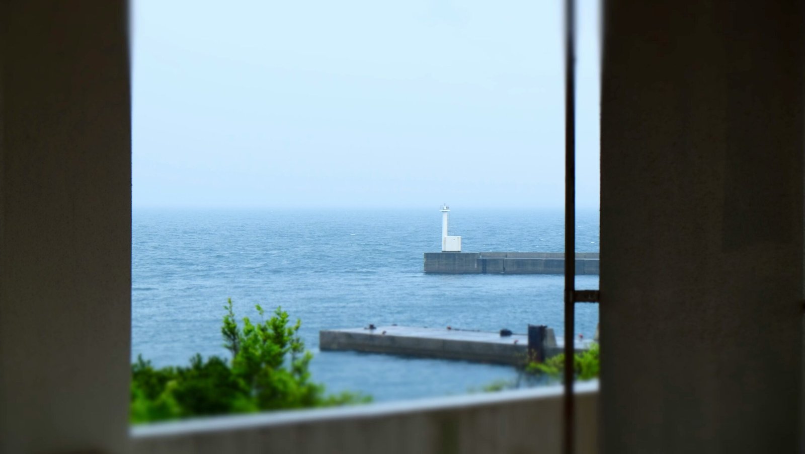 a view of the ocean from a window